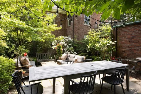 a outdoor dining space with furniture and potted plants