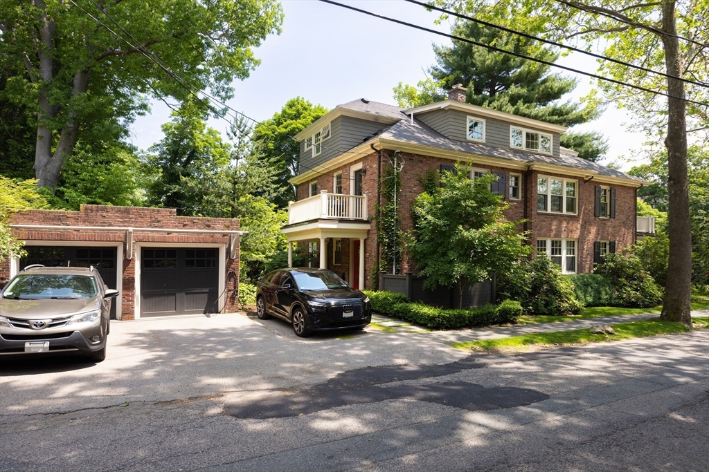 87 Greenough Street, Unit 2 Brookline, MA 02445 - Photo 23 of 23 a view of a car parked in front of a brick house