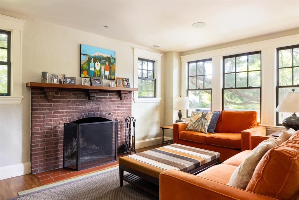 87 Greenough Street, Unit 2 Brookline, MA 02445 - Photo 9 of 23 a living room with furniture and a fireplace