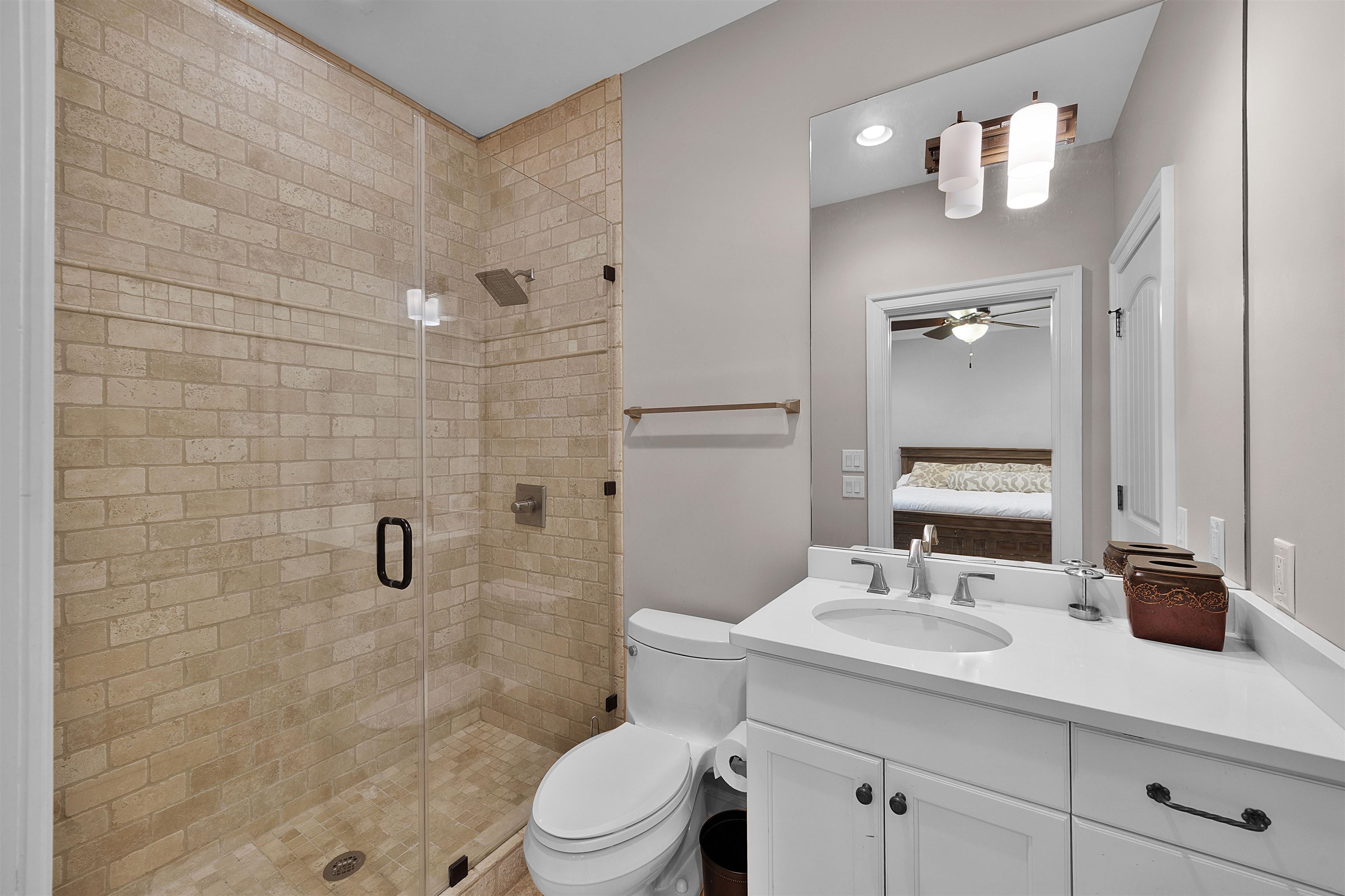 25 Caney Hollow Road Counce, TN 38326 - Photo 23 of 40 Full bathroom featuring ensuite bathroom, a stall shower, vanity, toilet, and ceiling fan