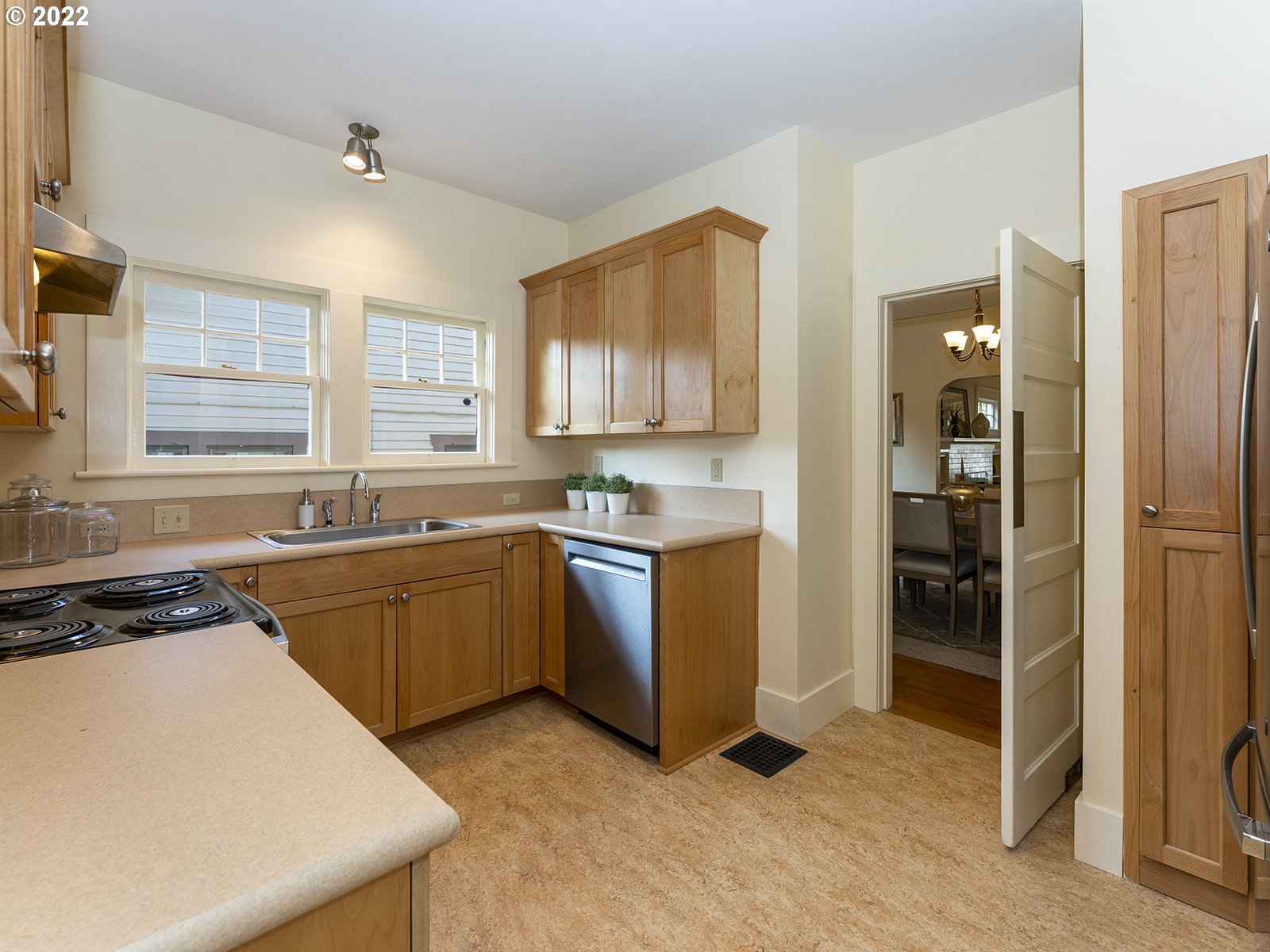 2424 Southeast Caruthers Street Portland, OR 97214 - Photo 13 of 32 a kitchen with sink a refrigerator and window