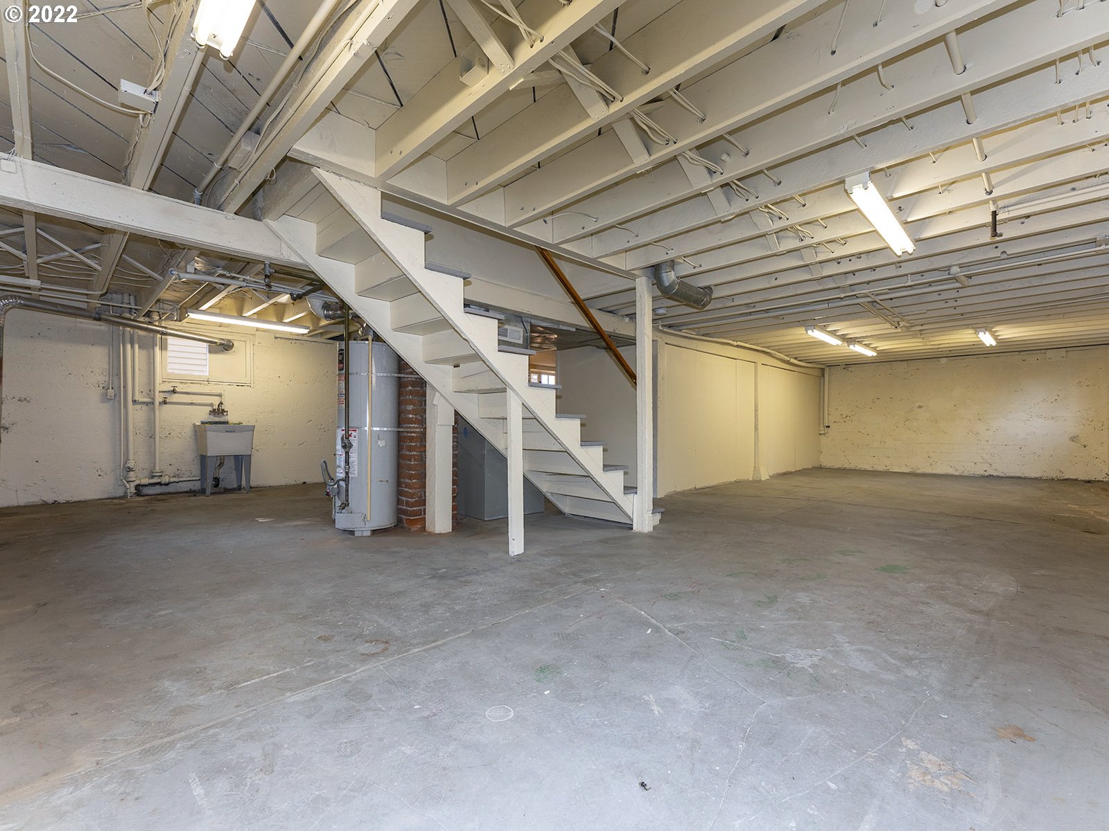 2424 Southeast Caruthers Street Portland, OR 97214 - Photo 27 of 32 a view of empty room with wooden ceiling