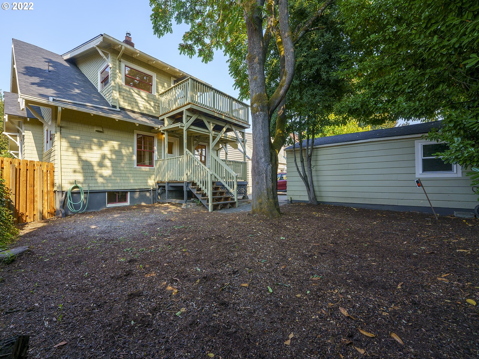 2424 Southeast Caruthers Street Portland, OR 97214 - Photo 29 of 32 a view of a house with a backyard