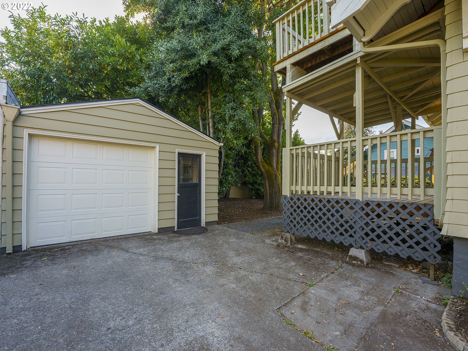 2424 Southeast Caruthers Street Portland, OR 97214 - Photo 30 of 32 a front view of a house with a garage