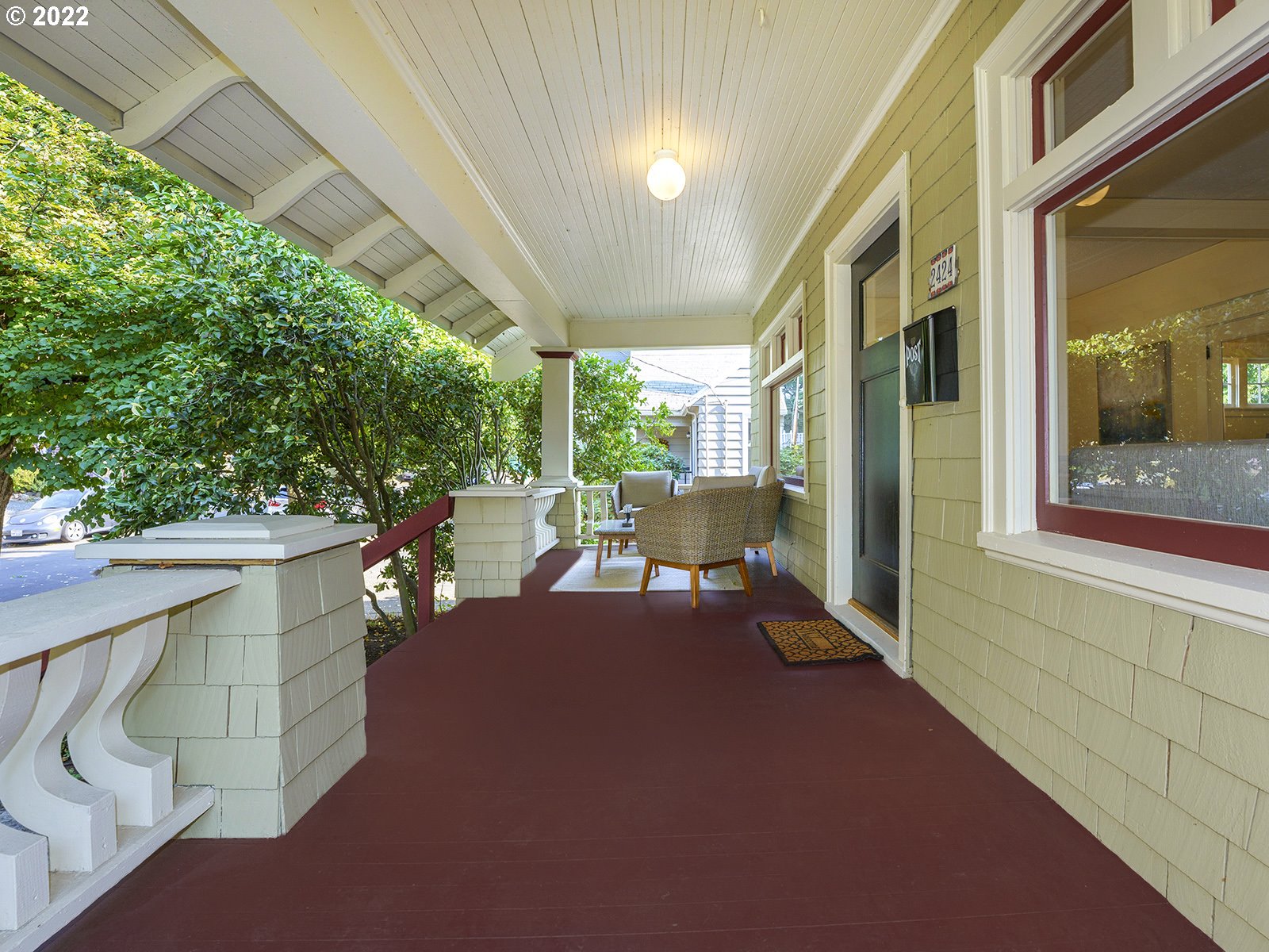 2424 Southeast Caruthers Street Portland, OR 97214 - Photo 3 of 32 a patio with table and chairs and potted plants