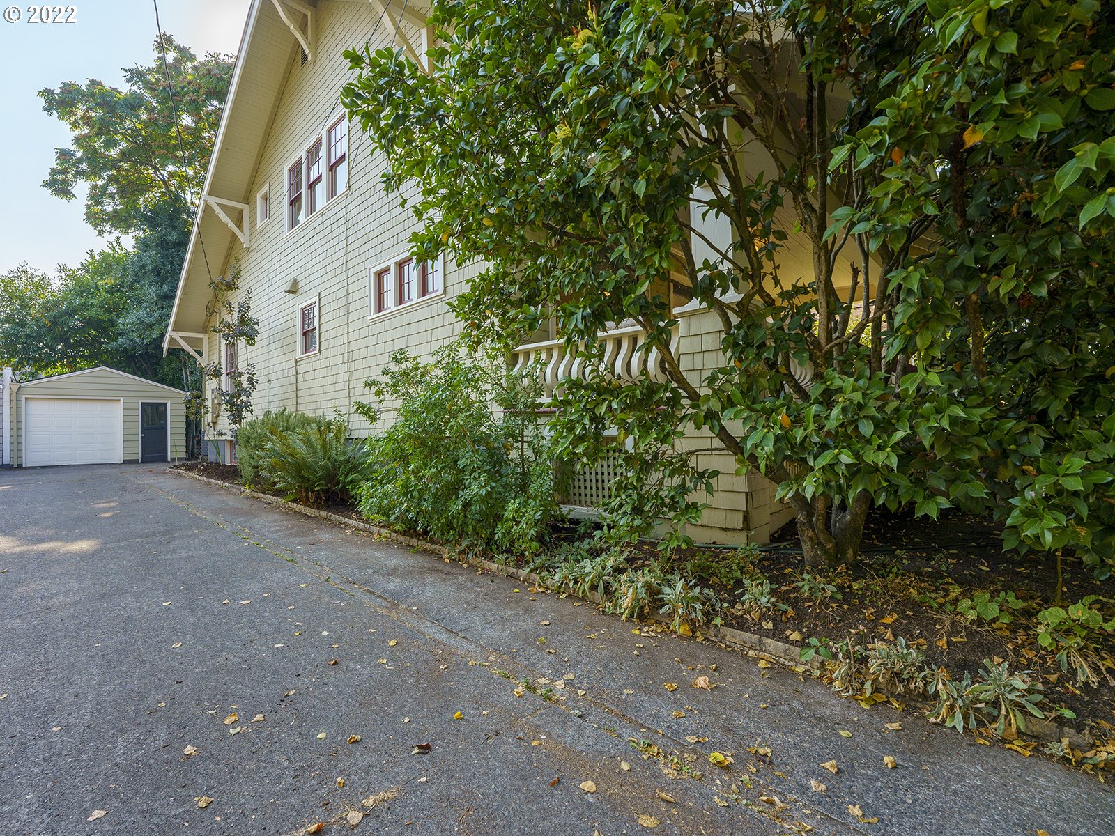 2424 Southeast Caruthers Street Portland, OR 97214 - Photo 31 of 32 a view of a house with a yard