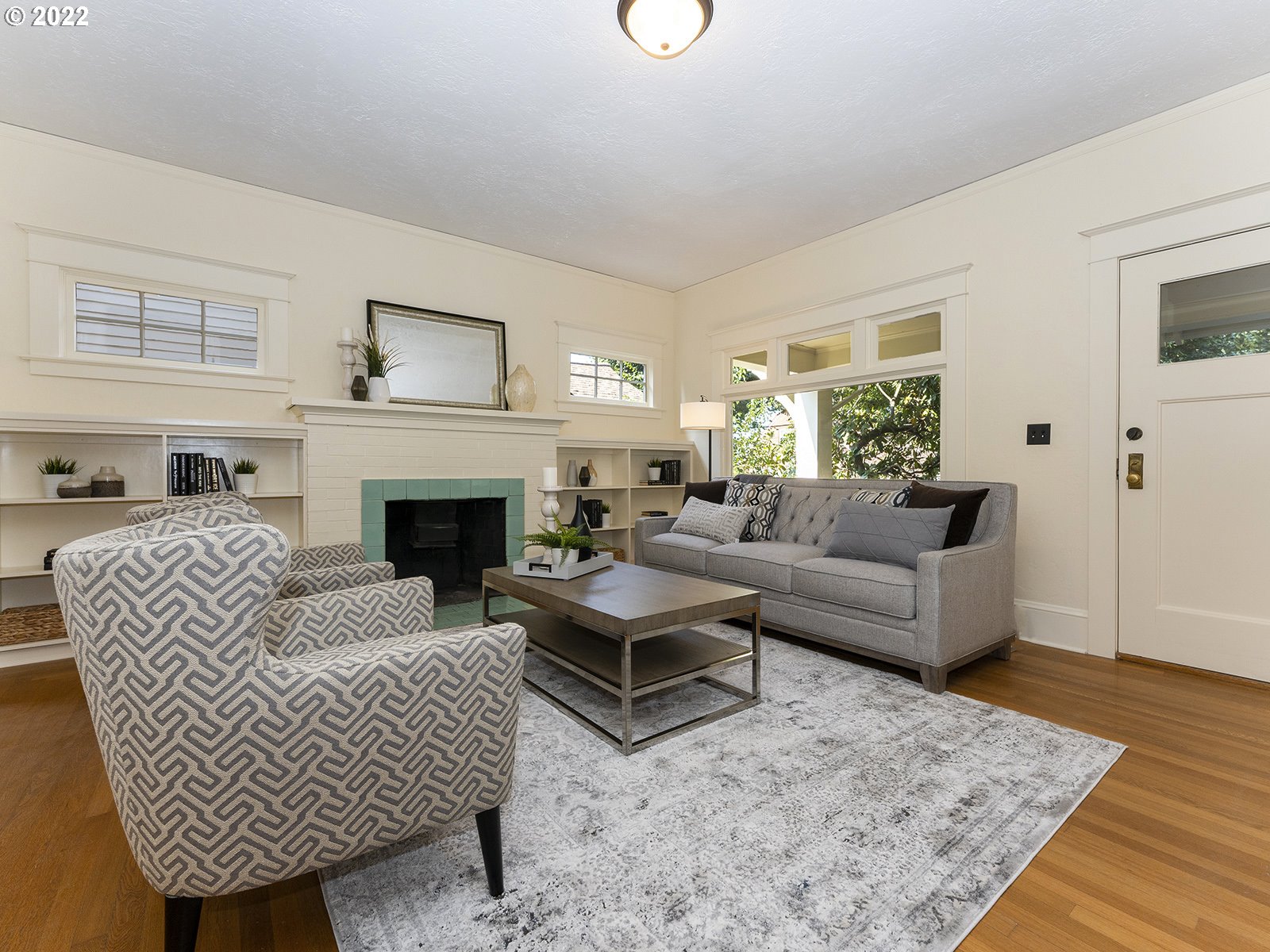 2424 Southeast Caruthers Street Portland, OR 97214 - Photo 4 of 32 a living room with furniture and a fireplace