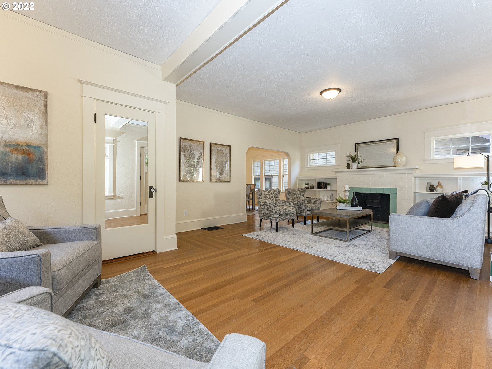 2424 Southeast Caruthers Street Portland, OR 97214 - Photo 6 of 32 a living room with furniture and a fireplace