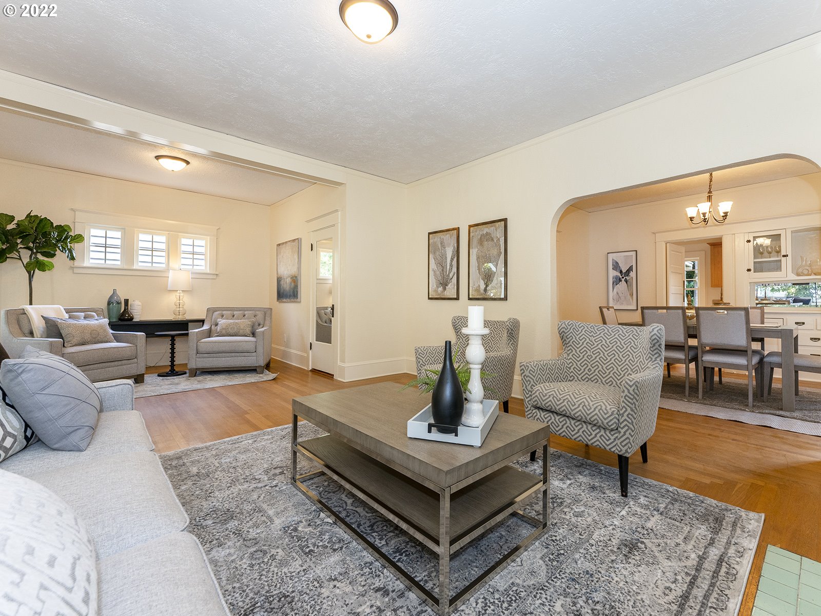 2424 Southeast Caruthers Street Portland, OR 97214 - Photo 7 of 32 a living room with furniture and a dining table
