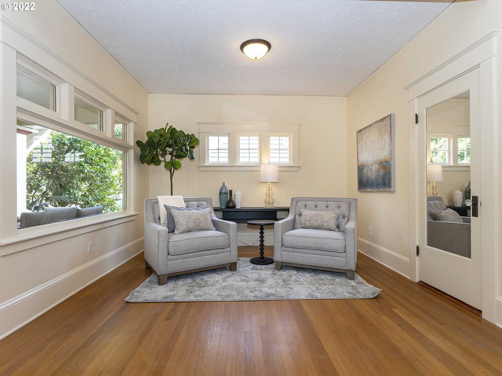2424 Southeast Caruthers Street Portland, OR 97214 - Photo 8 of 32 a living room with furniture and a large window