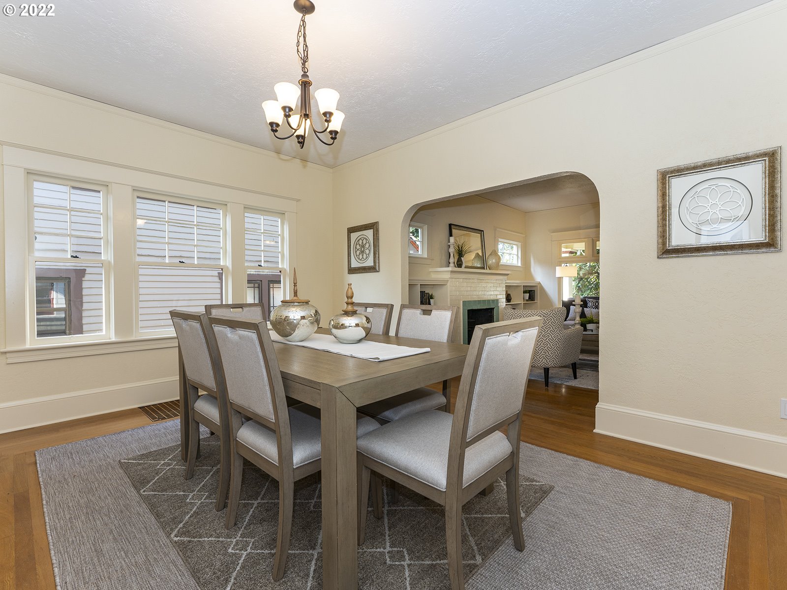 2424 Southeast Caruthers Street Portland, OR 97214 - Photo 9 of 32 a view of a dining room with furniture and chandelier