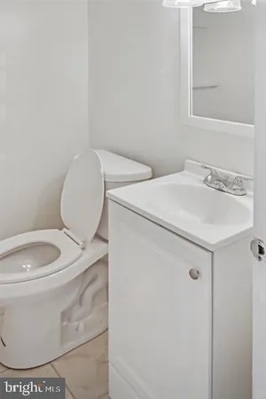 a bathroom with a toilet and a sink