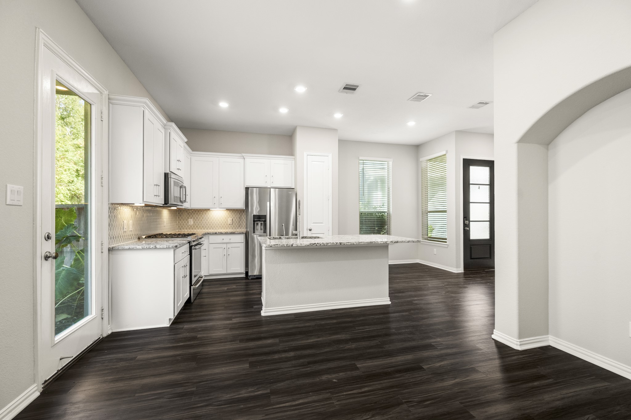 162 Moon Dance Court Conroe, TX 77304 - Photo 13 of 36 a kitchen with counter top space and window