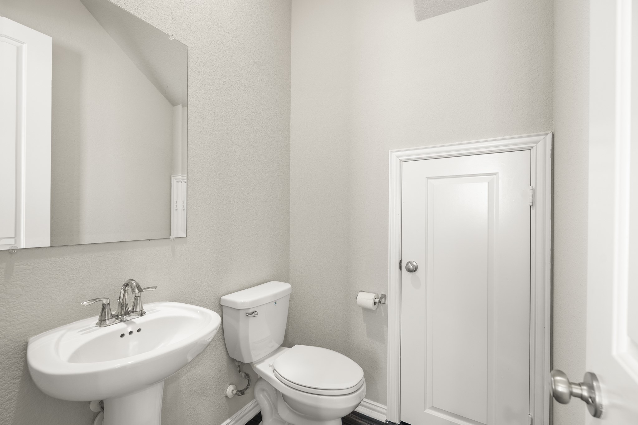 162 Moon Dance Court Conroe, TX 77304 - Photo 14 of 36 a bathroom with a sink a toilet and mirror