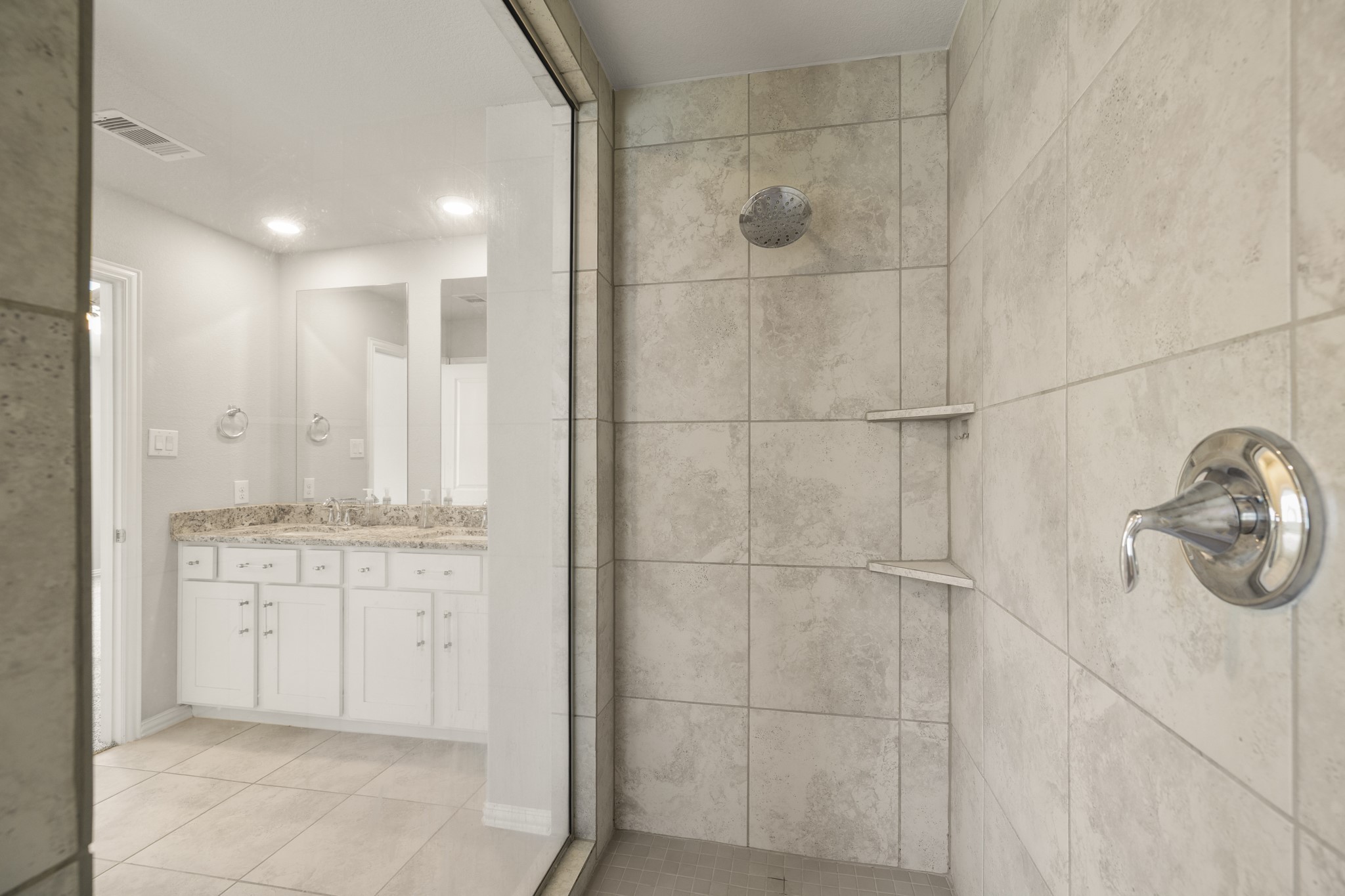 162 Moon Dance Court Conroe, TX 77304 - Photo 21 of 36 a bathroom with a shower and a sink