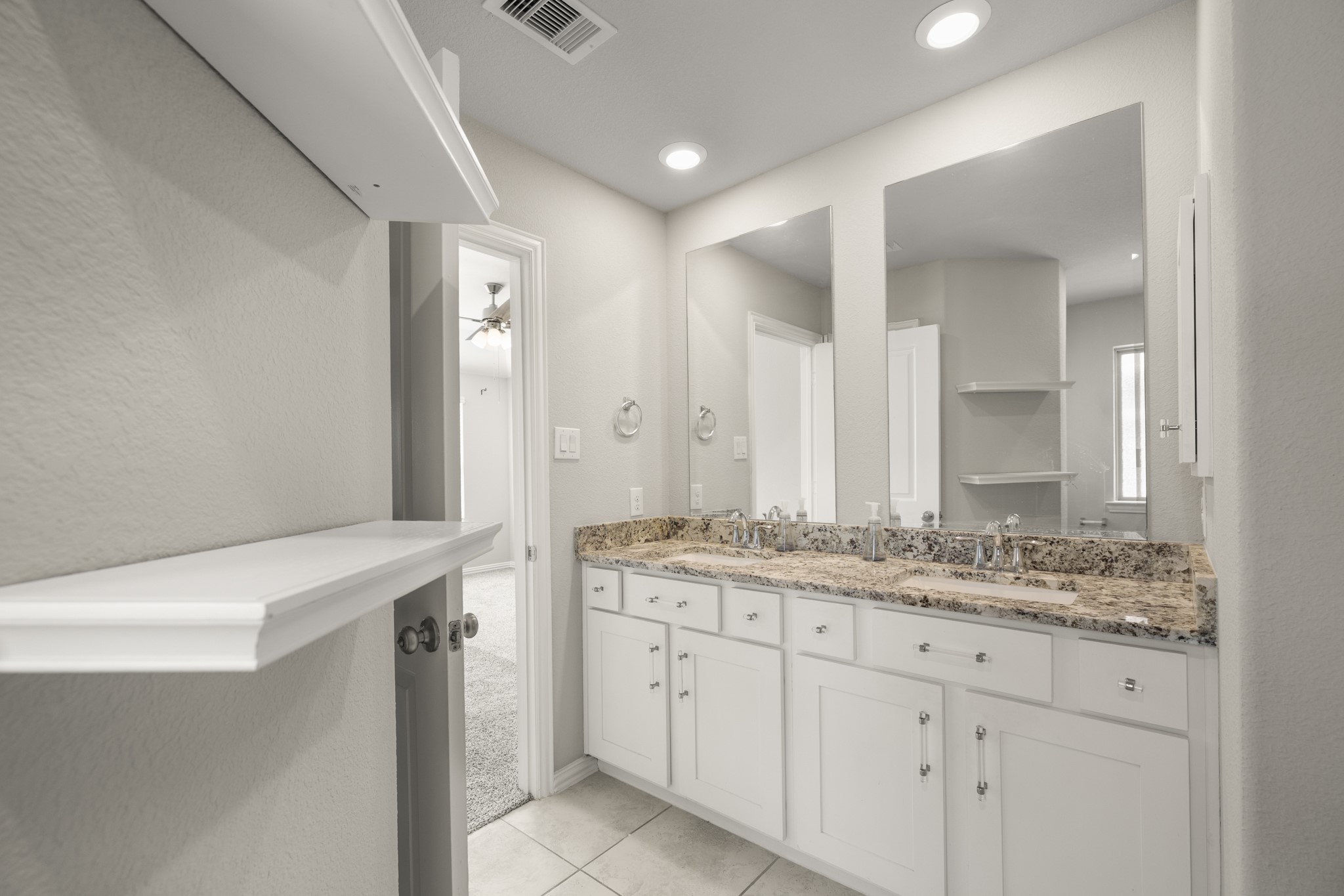 162 Moon Dance Court Conroe, TX 77304 - Photo 22 of 36 a bathroom with a granite countertop sink and a mirror