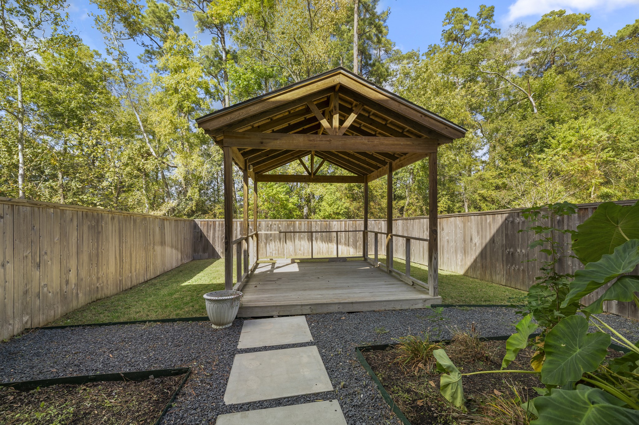 162 Moon Dance Court Conroe, TX 77304 - Photo 29 of 36 a view of a pathway of a house with a yard