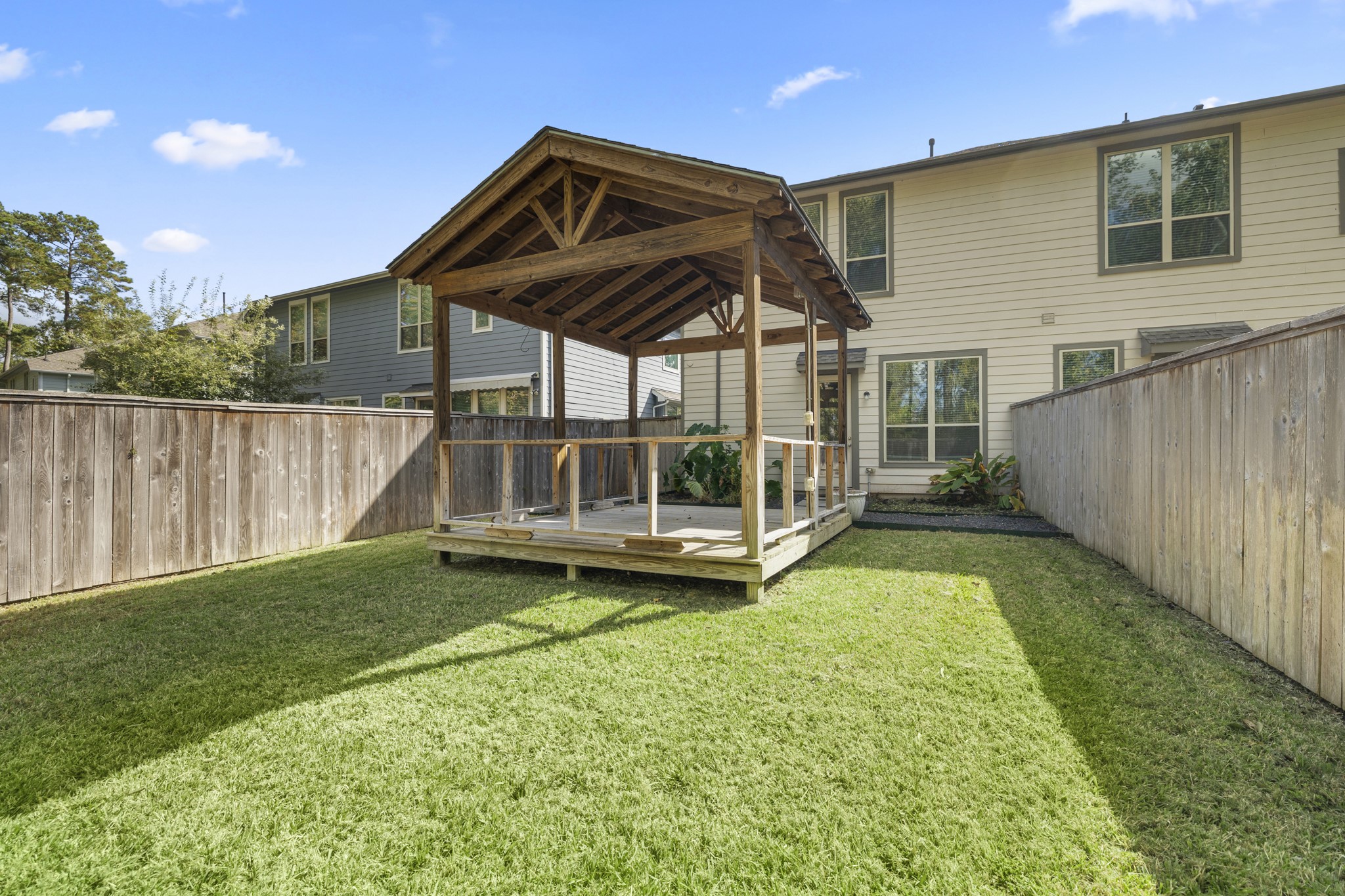 162 Moon Dance Court Conroe, TX 77304 - Photo 34 of 36 a view of a house with backyard and porch