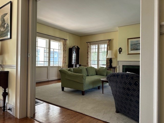 48 Proctor Street Manchester, MA 01944 - Photo 14 of 39 a living room with furniture and a fireplace