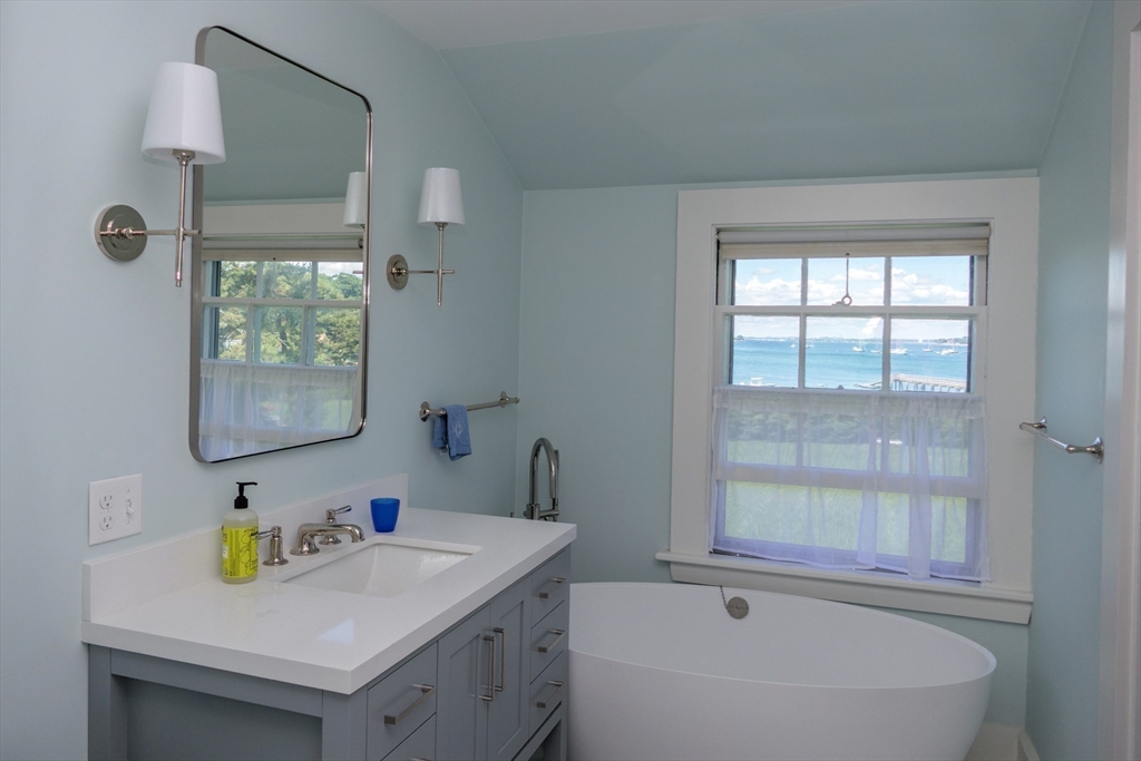 48 Proctor Street Manchester, MA 01944 - Photo 17 of 39 a bathroom with a sink and a bathtub