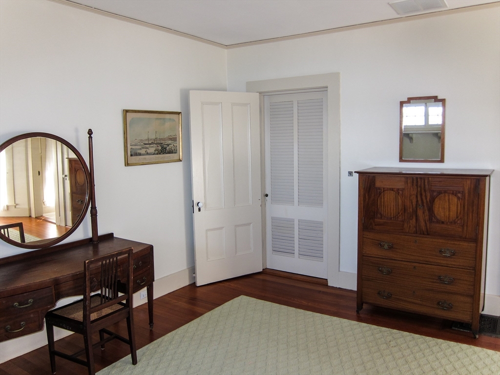 48 Proctor Street Manchester, MA 01944 - Photo 21 of 39 a bedroom with a bed and a dresser