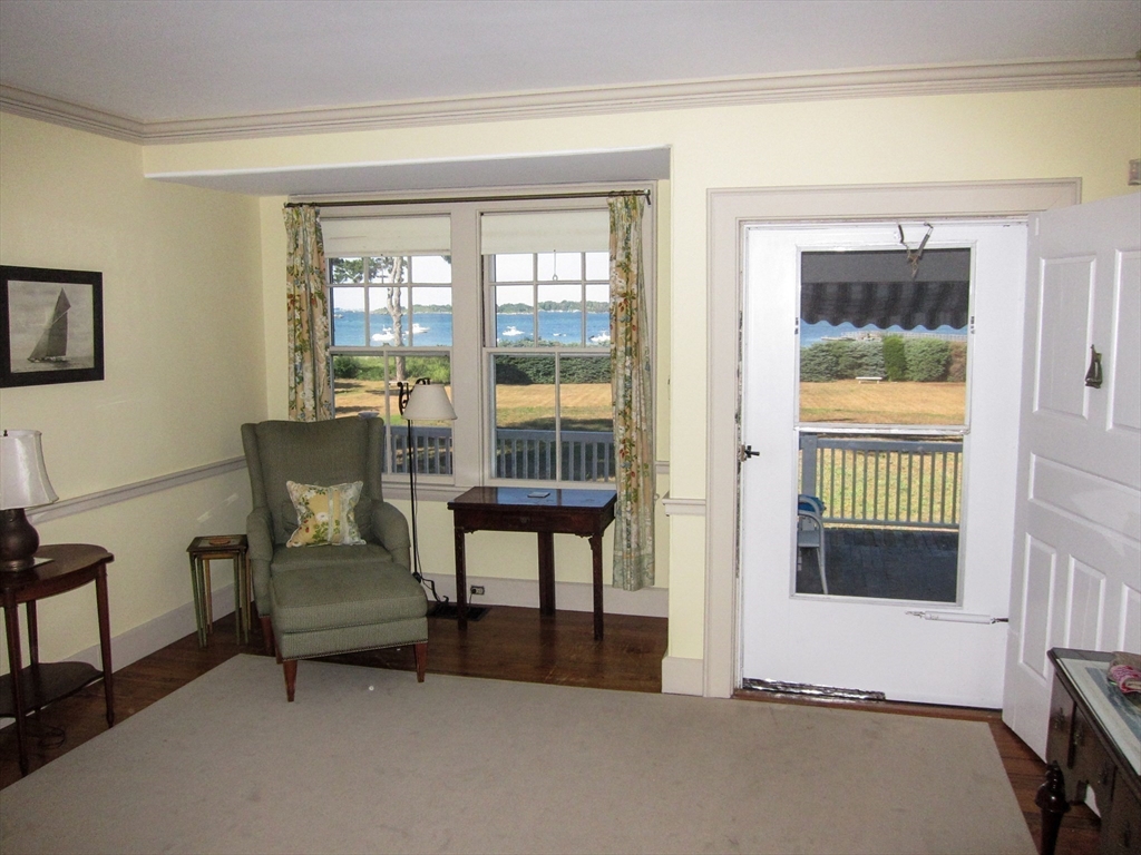 48 Proctor Street Manchester, MA 01944 - Photo 25 of 39 a view of a livingroom with furniture and a window