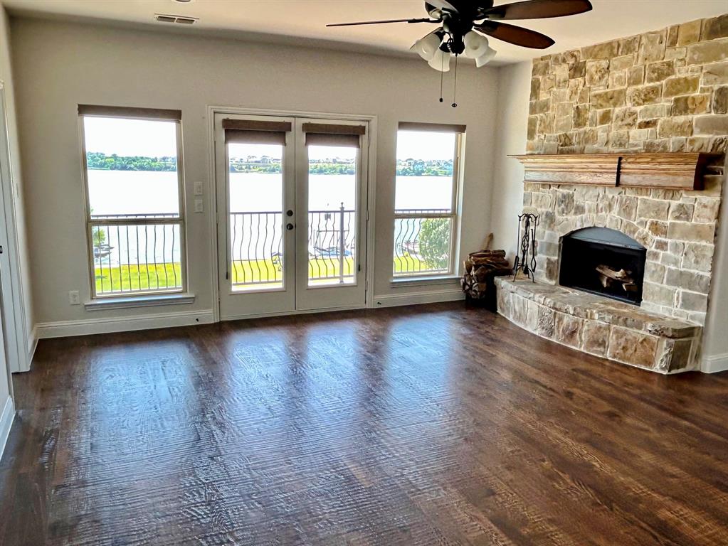 2313 Windjammer Way Rowlett, TX 75088 - Photo 17 of 38 a view of an empty room with a fireplace and a window