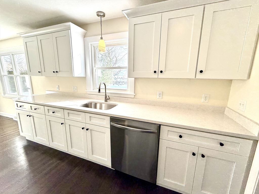 30 Alroy Road Weymouth, MA 02190 - Photo 15 of 40 a kitchen with stainless steel appliances white cabinets and a sink