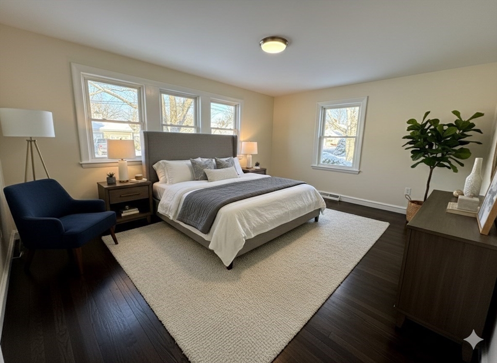 30 Alroy Road Weymouth, MA 02190 - Photo 27 of 40 a bedroom with a bed lamp on desk and a window