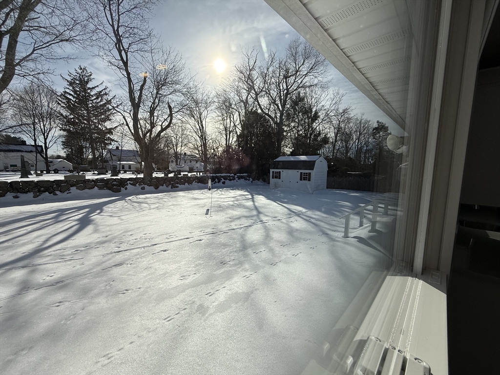 30 Alroy Road Weymouth, MA 02190 - Photo 6 of 40 a view of a yard with snow on the road