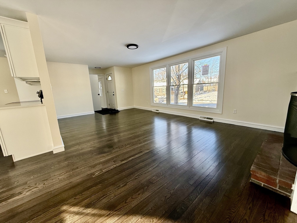 30 Alroy Road Weymouth, MA 02190 - Photo 9 of 40 wooden floor in an empty room with a window