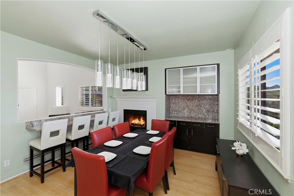 16123 Setting Sun Circle Riverside, CA 92503 - Photo 20 of 67 a view of a dining room with furniture window and wooden floor