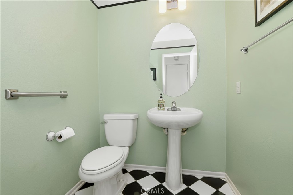 16123 Setting Sun Circle Riverside, CA 92503 - Photo 25 of 67 a bathroom with a sink toilet and a mirror