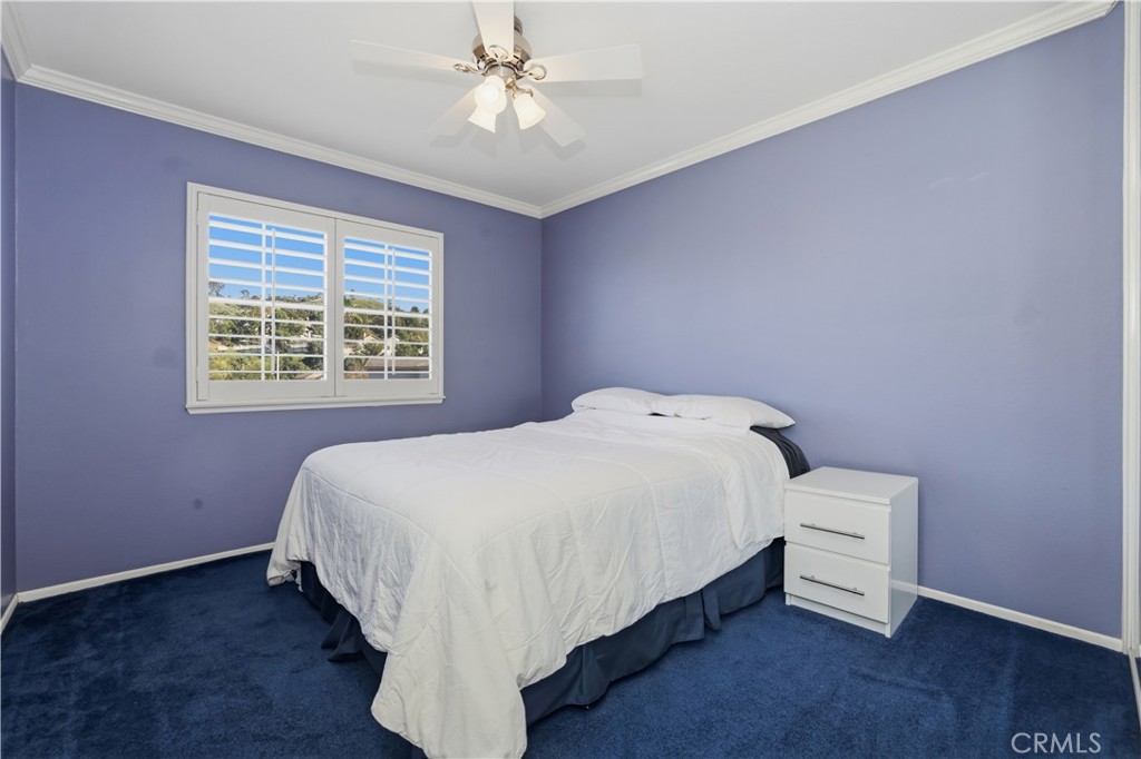 16123 Setting Sun Circle Riverside, CA 92503 - Photo 28 of 67 a bed sitting in a spacious bedroom next to a window