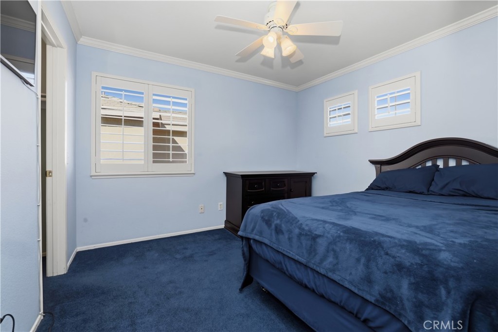 16123 Setting Sun Circle Riverside, CA 92503 - Photo 30 of 67 a bedroom with a bed dresser and a window