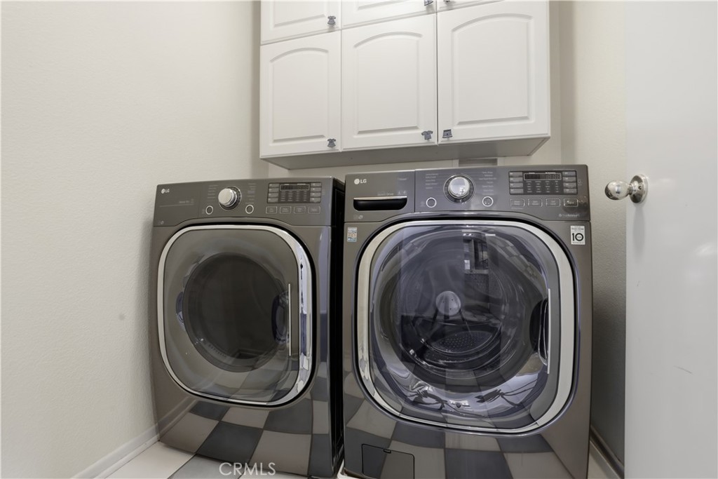 16123 Setting Sun Circle Riverside, CA 92503 - Photo 31 of 67 a utility room with dryer and washer