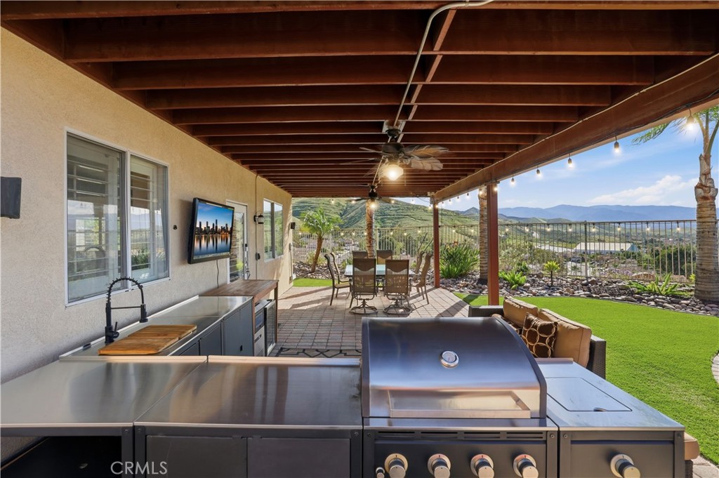 16123 Setting Sun Circle Riverside, CA 92503 - Photo 40 of 67 a view of a patio with a table chairs and a table