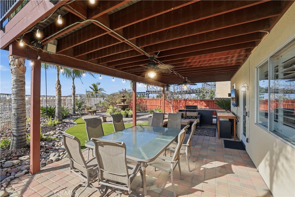 16123 Setting Sun Circle Riverside, CA 92503 - Photo 43 of 67 a view of a porch with furniture and a grill