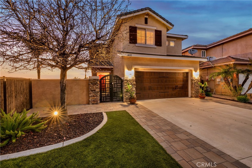 16123 Setting Sun Circle Riverside, CA 92503 - Photo 10 of 67 a front view of a house with garden