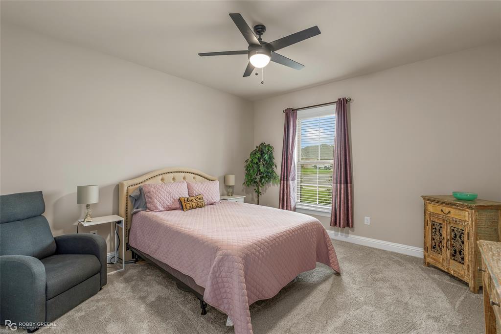 122 Brimestone Loop Benton, LA 71006 - Photo 20 of 33 a bedroom with a bed couch and window