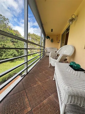 a balcony with wooden floor