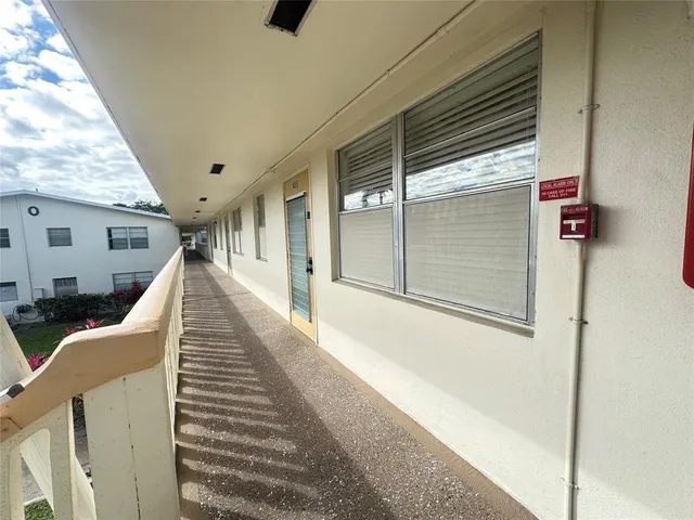 a view of a house with stairs and wooden floor