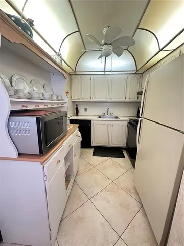 a kitchen with a stove and a refrigerator