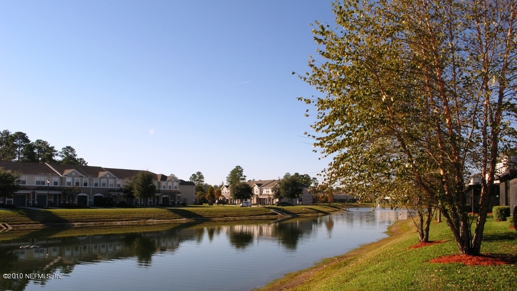 5880 Sandstone Way Jacksonville, FL 32258 - Photo 11 of 20 a view of a lake with houses
