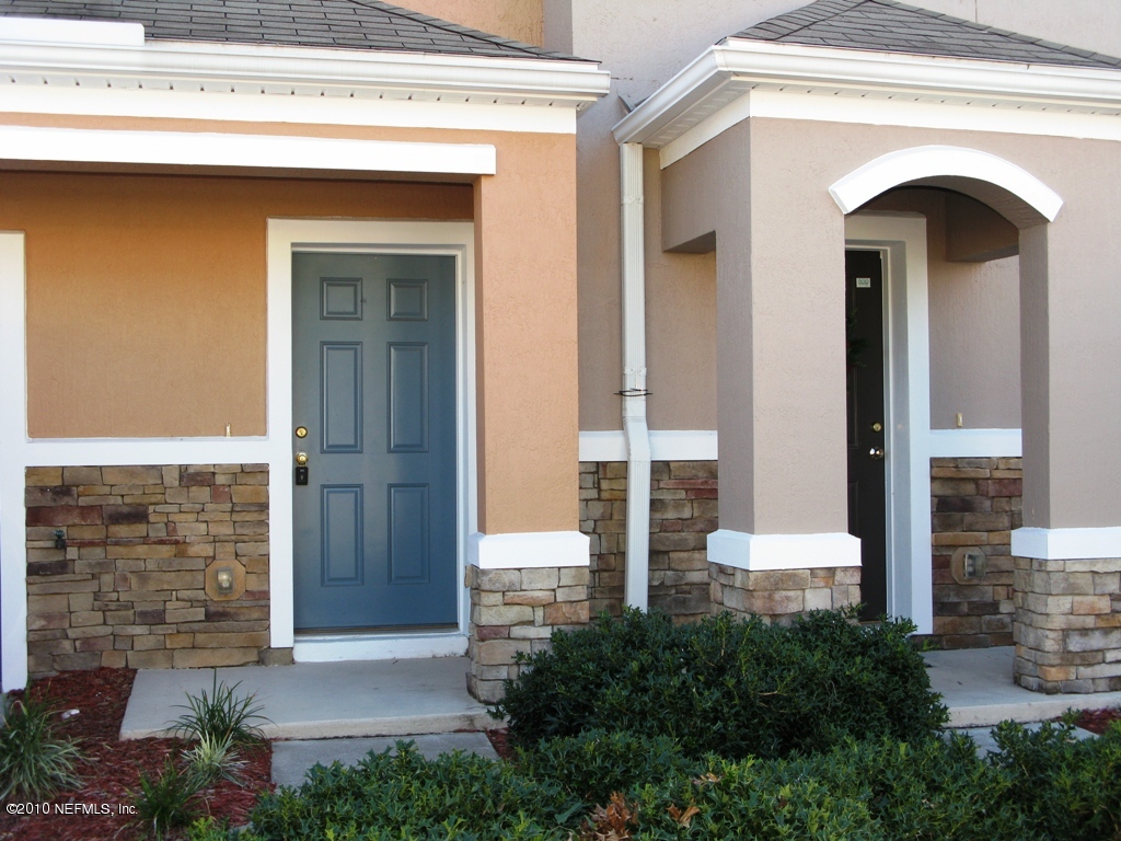 5880 Sandstone Way Jacksonville, FL 32258 - Photo 12 of 20 a front view of a house with stairs
