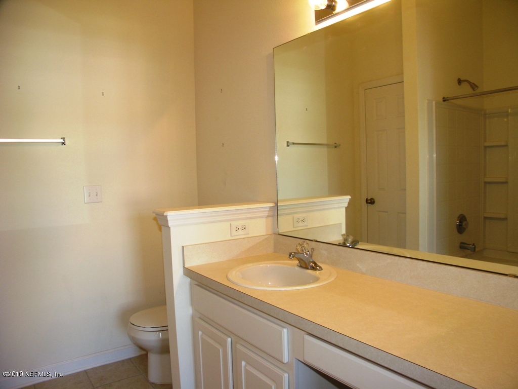 5880 Sandstone Way Jacksonville, FL 32258 - Photo 18 of 20 a bathroom with a sink and a toilet