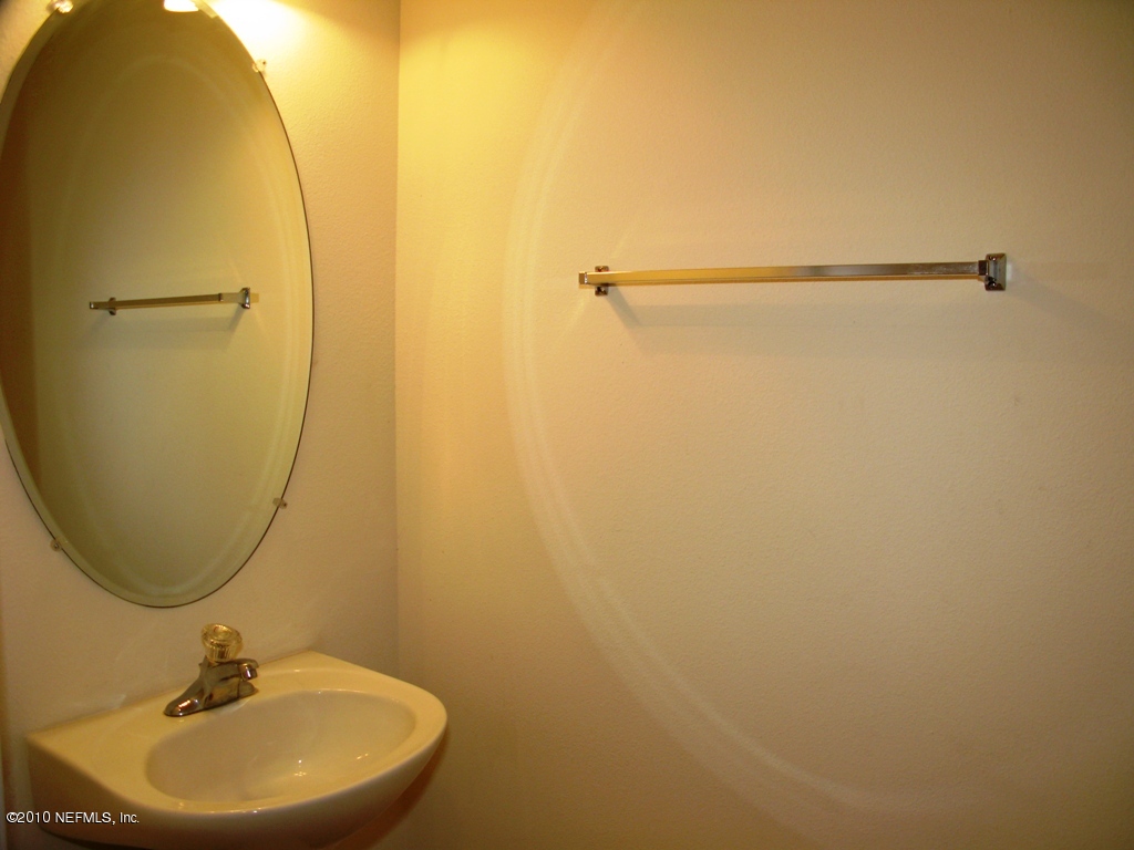 5880 Sandstone Way Jacksonville, FL 32258 - Photo 20 of 20 a bathroom with a sink and a mirror