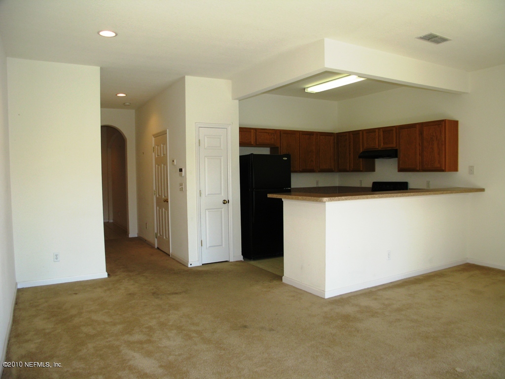 5880 Sandstone Way Jacksonville, FL 32258 - Photo 5 of 20 a view of a kitchen with a sink and cabinets
