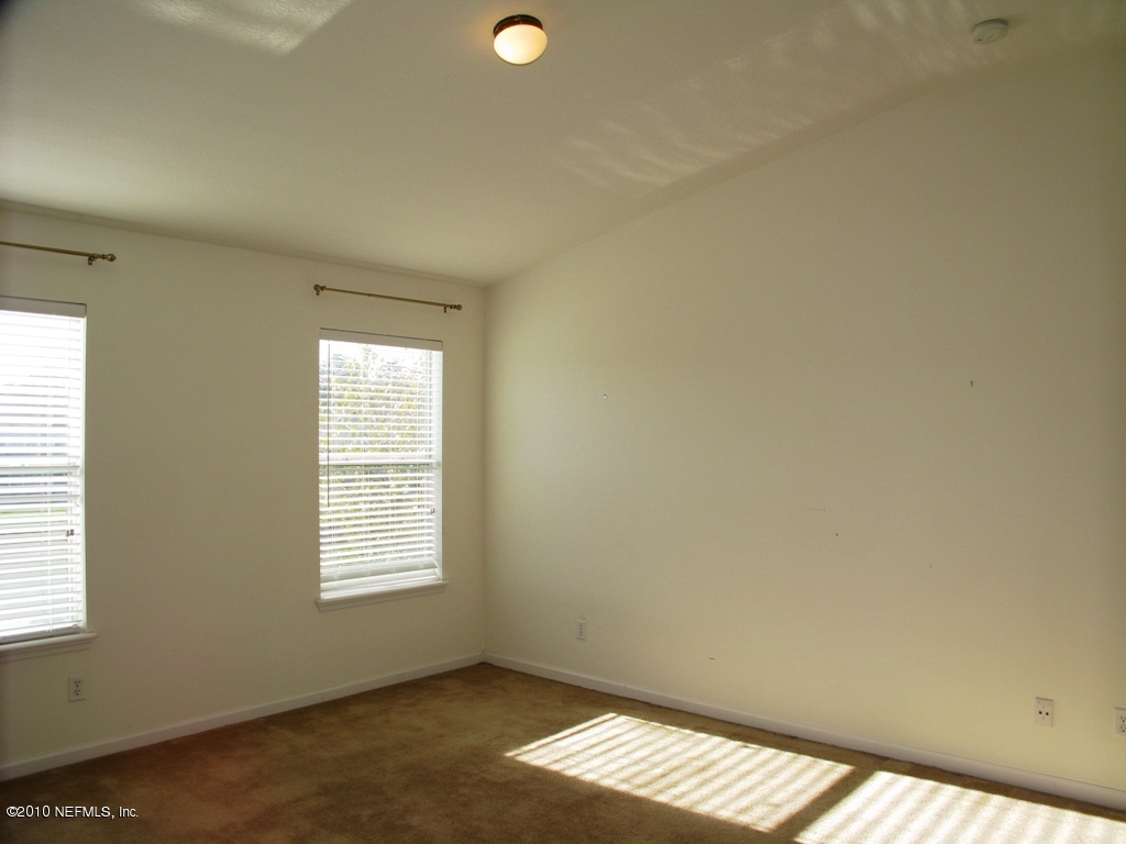 5880 Sandstone Way Jacksonville, FL 32258 - Photo 7 of 20 an empty room with windows