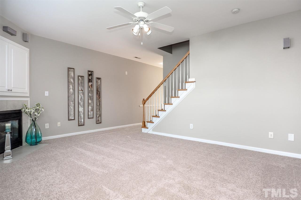 2041 Rivergate Road, Unit 105 Raleigh, NC 27614 - Photo 2 of 9 a view of an empty room with a fireplace